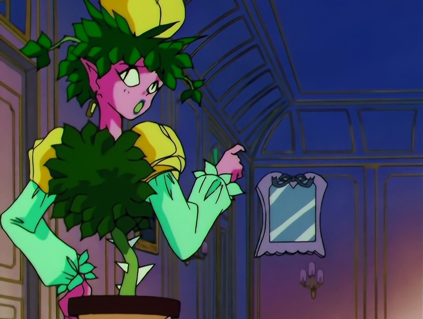 TogeToge Jou, a Lemures from Sailor Moon episode 156. We see her mostly from behind, and she has bright pink skin and green leaves for hair, with a yellow rose on top of her head. Her upper torso is also a mass of leaves, and she has light green puffy sleeves with yellow rose shoulder pads. Her lower torso is just a spiked green plant stem, coming up from her pelvis, which is a plant pot. She’s looking back skeptically while pointing at a dream mirror. Another top tier bit of monster design that leaves me feeling slightly uncomfortable.